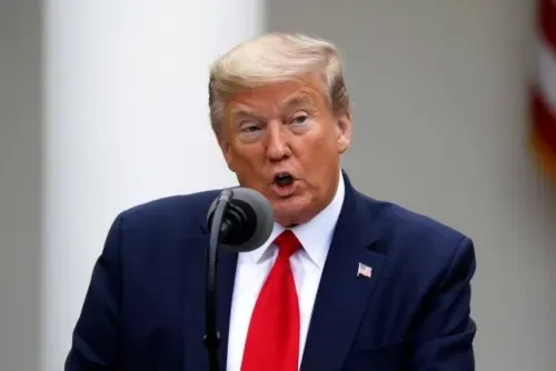 Defiant Trump defends virus record in 1st post-COVID rally