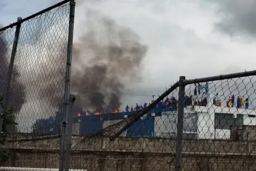 Venezuela inmates occupy prison roof and set fire to mattresses to protest alleged abuses