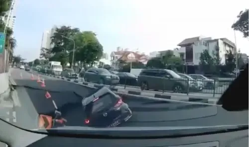 Sinkhole Swallows Car on Busy Singapore Road