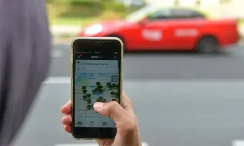 China minister warns on subsidies as Uber, Didi battle