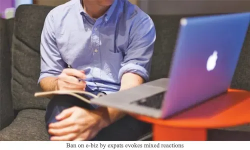 Ban on e-biz by expats evokes mixed reactions