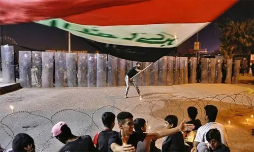 Iraq ratifies new election law, paving way for early vote