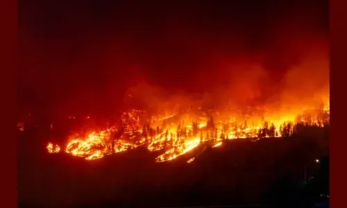 20,000 residents flee Canadian city as wildfires surge