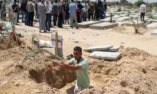 Gaza gravediggers, medics stretched as cases spike in Ramadan